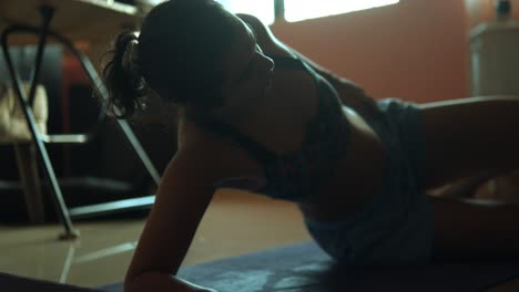 beautiful indian woman doing yoga exercises in the living room