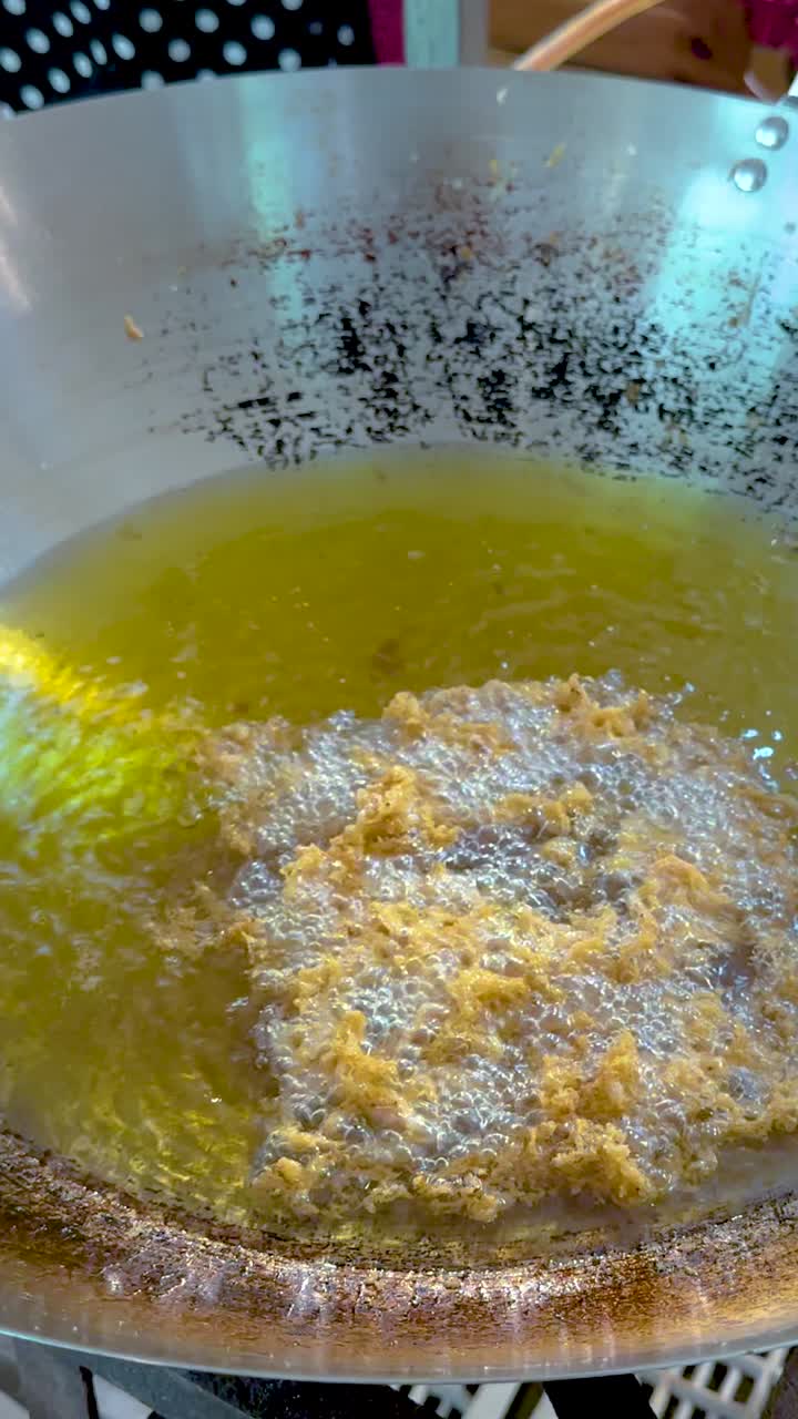 Cooking process in a large frying pan