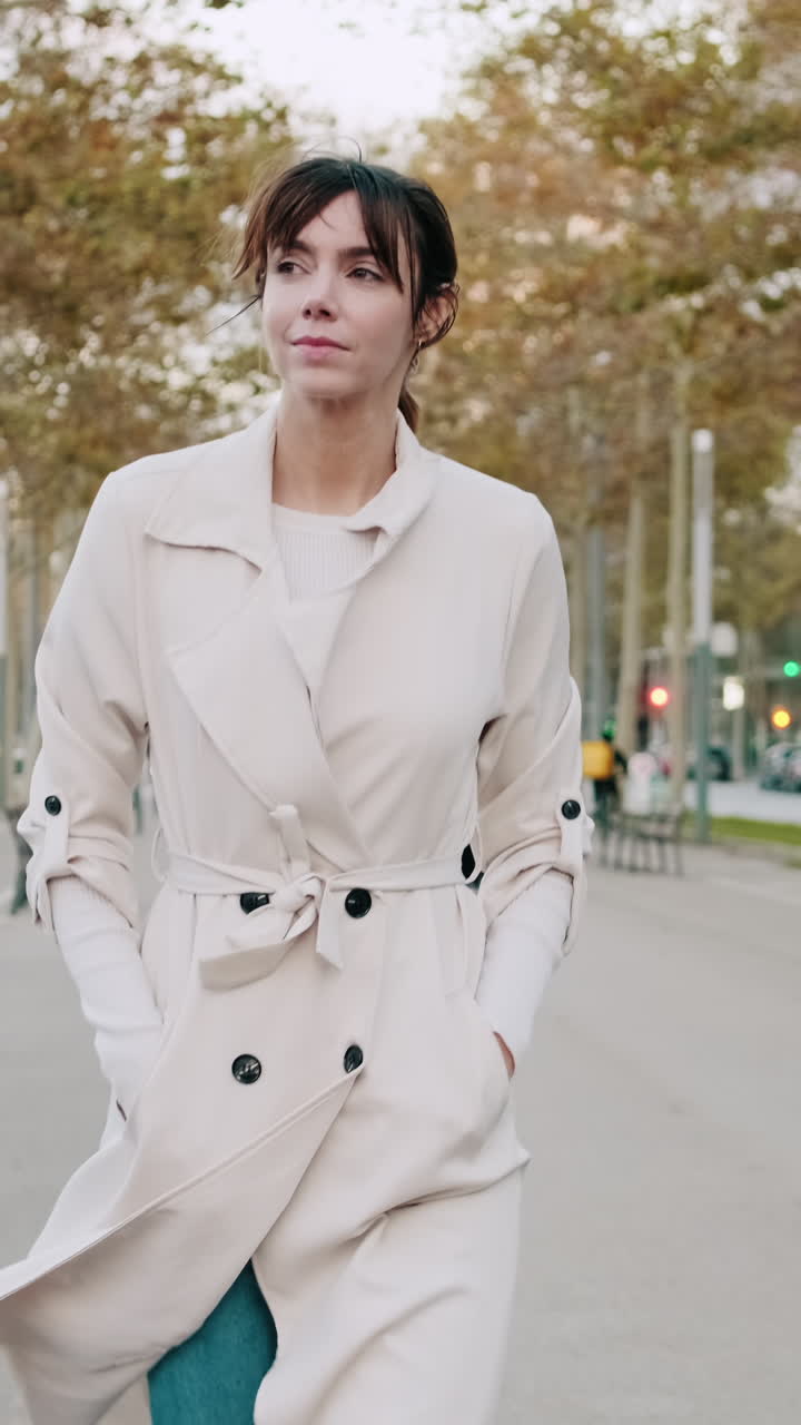Thoughtful Young Woman Walking in an Urban Park