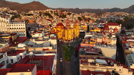 drone shot approaching the basilica of guanajuato, dramatic evening in mexico