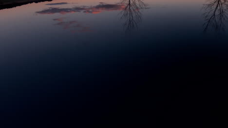 autumn landscape reflects on the roof of a car