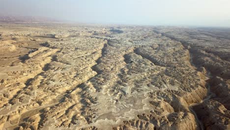 aerial view over large wadi with soft sedimentary rock, arava desert