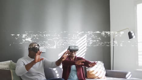 animation of vibes text over smiling senior african american couple using vr headsets