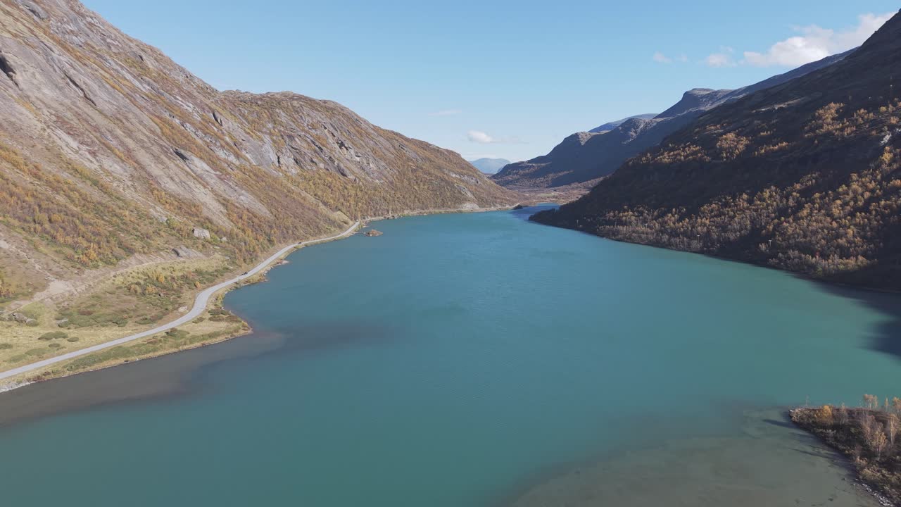 Turquoise green glacier lake in Jotunheimen National Park, Norway. Drone footage