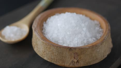 close up of sea salt in a wooden bowl