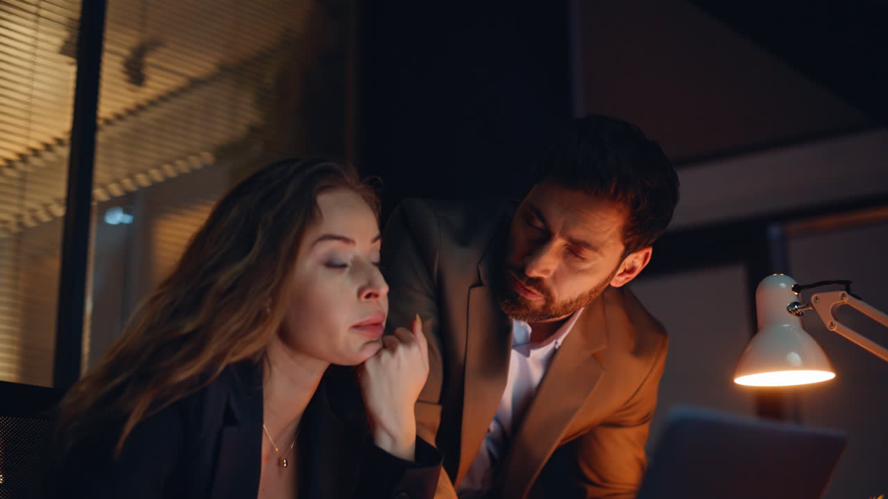 Portrait stressed colleagues overtime work solving problem at night workplace