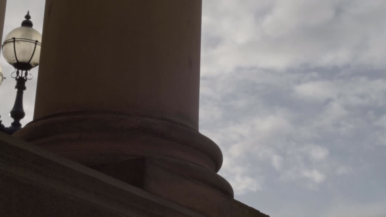 Ornate stone pillars against blue skies