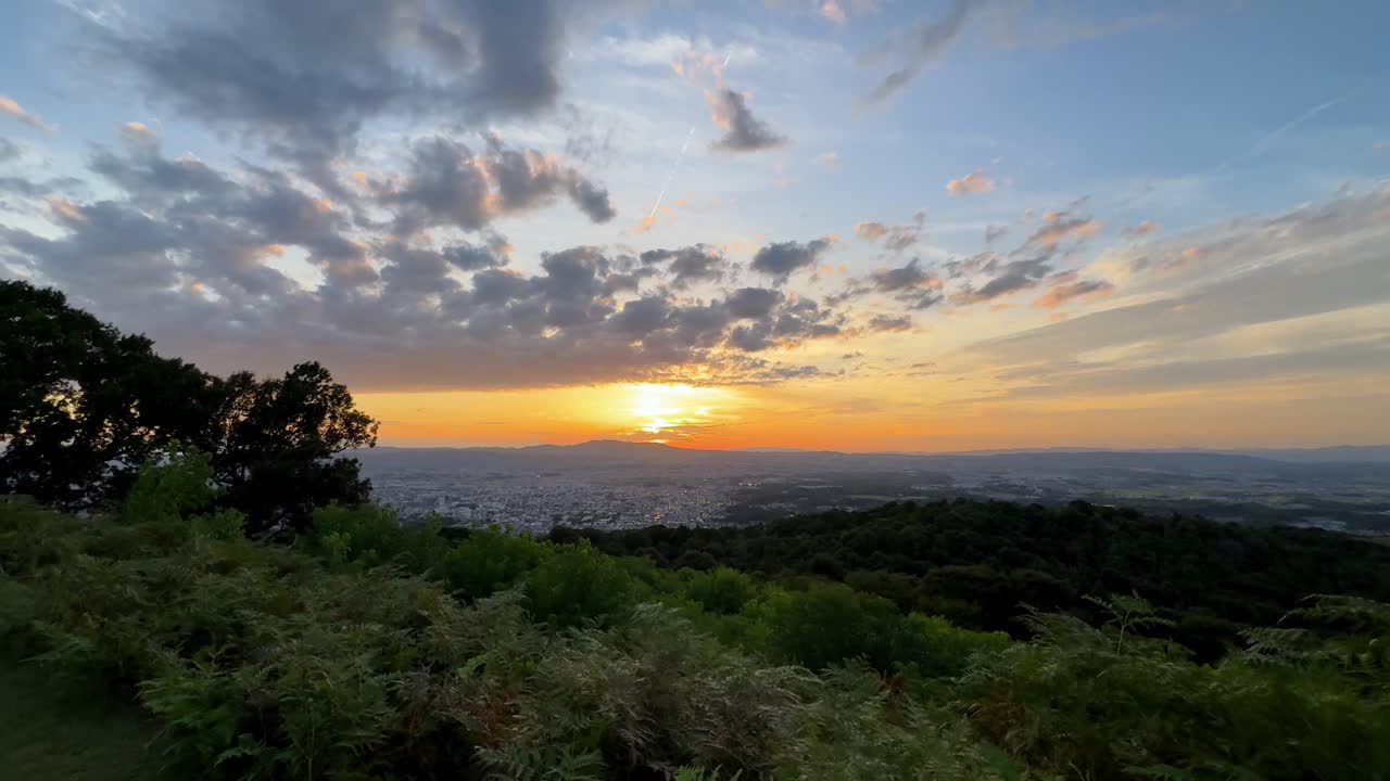 Sunset view from Mount Wakakusa, Nara with vibrant sky and calm mood