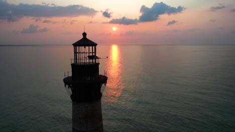 sunrise over a lighthouse