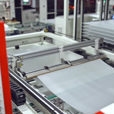 robotic machine makes solar panel indoors. automated technology of producing solar cells in a modern factory.