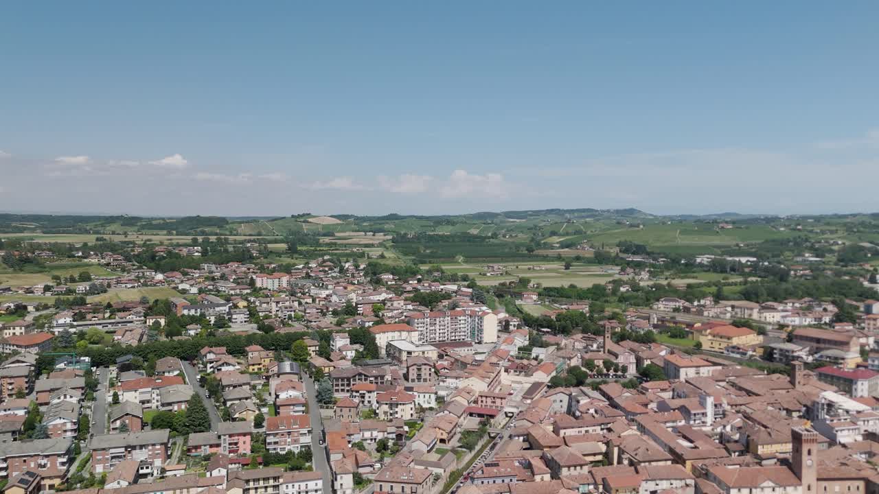 Nizza Monferrato, UNESCO site, Asti, Piedmont, Italy. 4k aerial view of the city. Langhe-Roero and Monferrato. Flying forward above the city with blue sky.