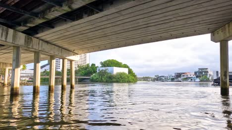 boat travels under bridge on gold coast