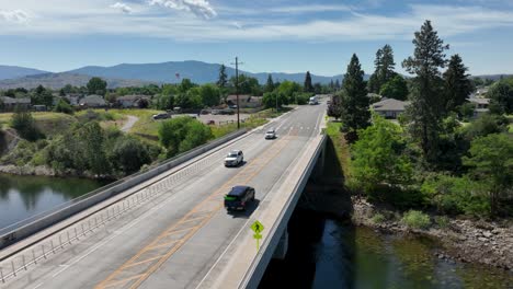 Aerial-shot-leaving-a-car-across-a-bridge-in-Spokane,-Washington