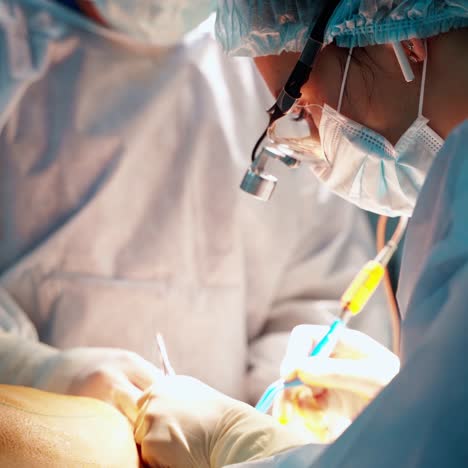 plastic surgeon performs an operation for abdominoplasty with a transfer of the navel. tummy tuck
