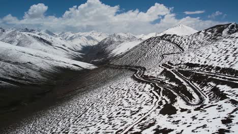 Aerial-view-of-Road-through-babusar-pass-in-winters,-via-Karakorum-highway-to-Gilgit-baltistan,-KPK-junction