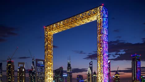 illuminated dubai frame glowing at sunset, showcasing vibrant colors while framing the stunning city skyline and creating a breathtaking visual spectacle in the evening sky