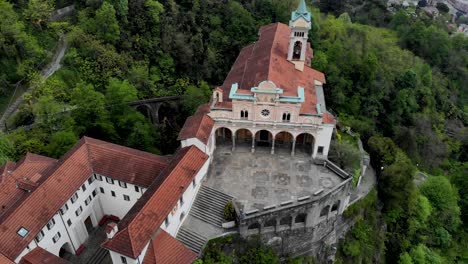 aerial view of the historical madonna del sasso church up above the city of locarno next to lago maggiore in ticino in south switzerland