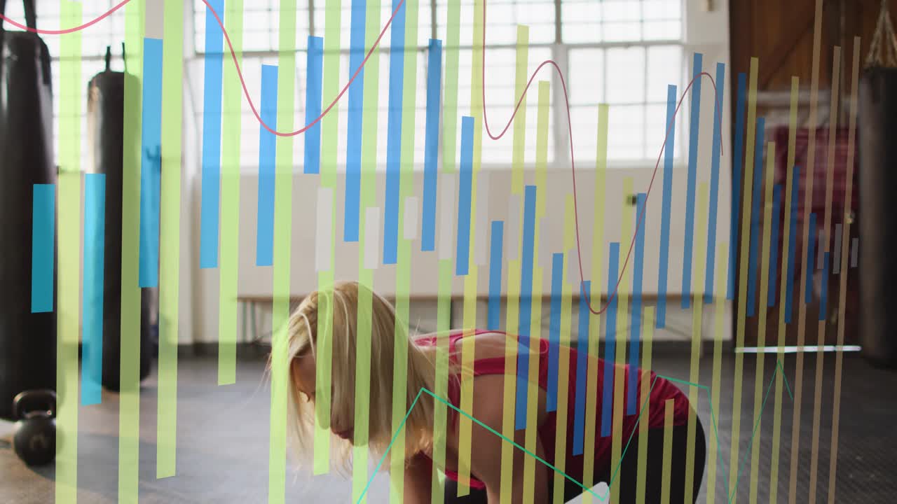 Trainer hinging and swinging KB, pressing overhead, lowering to plank with bars tracking fitness