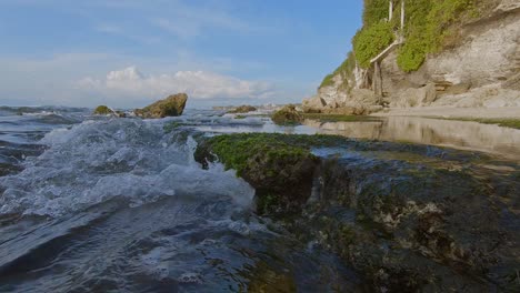 water running over rock puddles in bali, indonesia