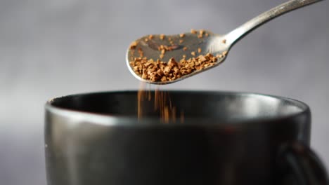 Close-up-of-mixing-coffee-power-with-hot-water