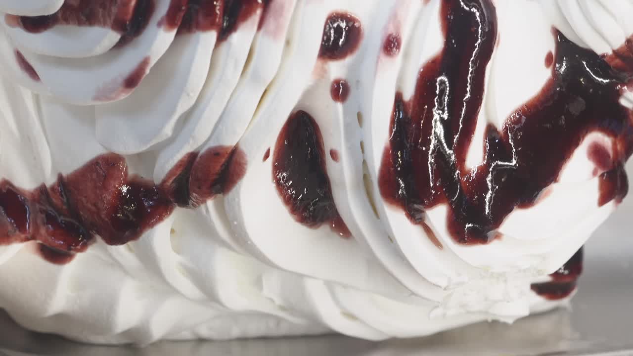 Close-up of Whipped Ice Cream with Berry Sauce