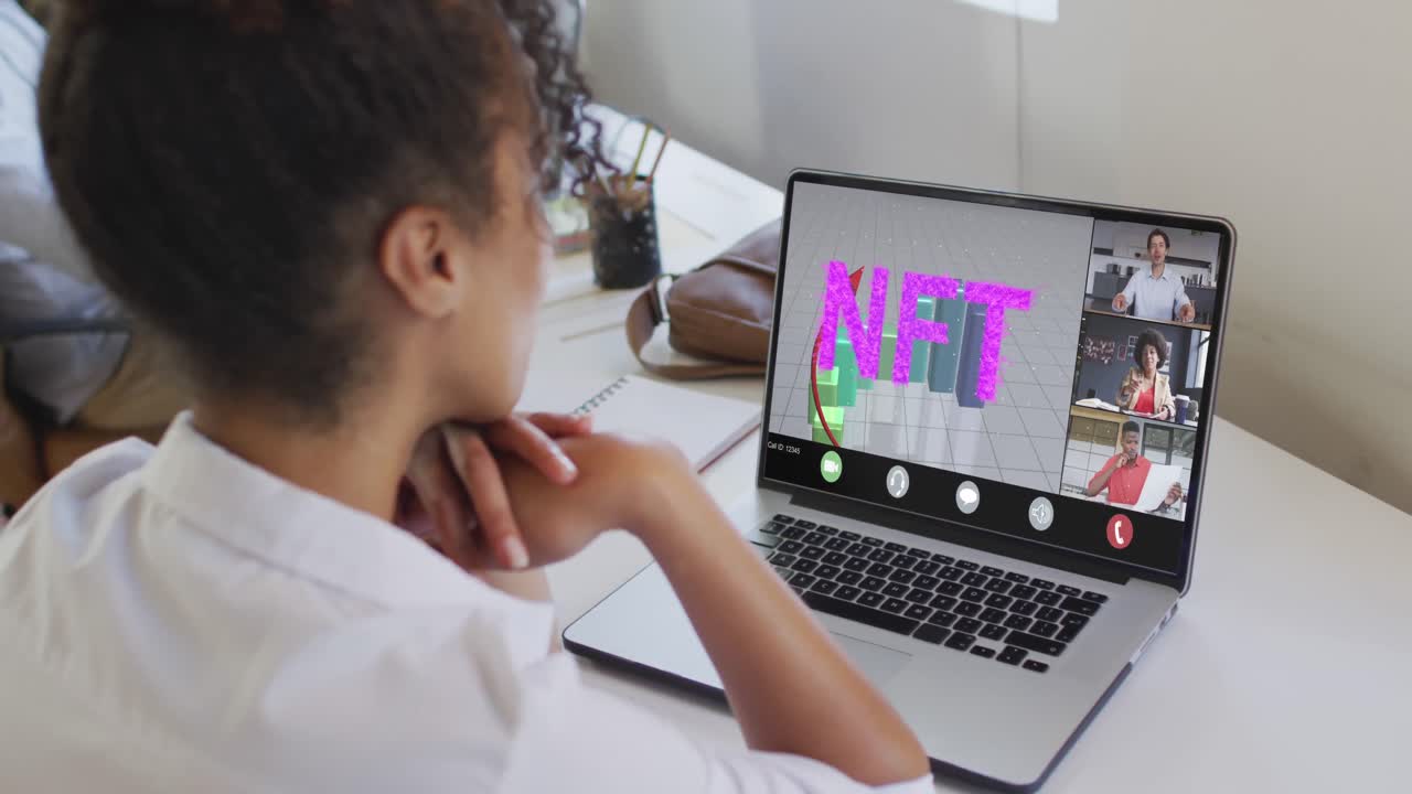 Video of biracial woman having nft video call on laptop with diverse coworkers