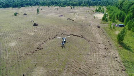 helicopter over a rural event in a field