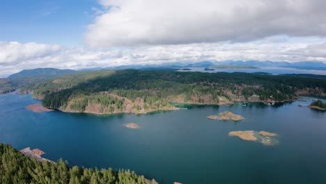 aerial flight over tree covered island isolated location on vancouver bc coast