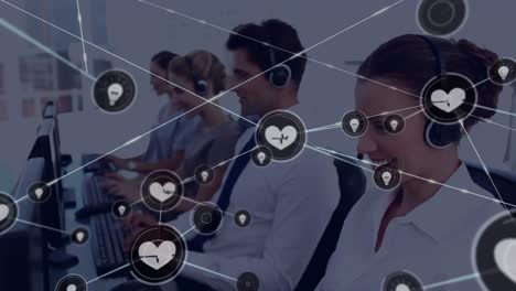 Animation-of-network-of-connection-with-icons-over-business-people-wearing-phone-headsets