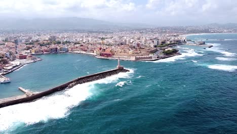 powerful waves hitting chania city coast, aerial drone view