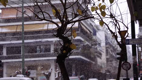 shot of athens city centre neighbourhood while is snowing , bad weather greece