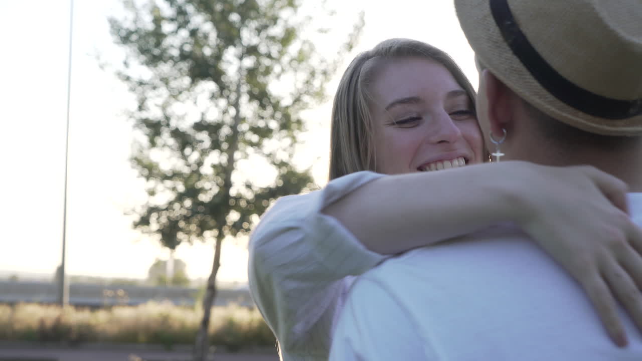 Couple in love and happy kissing in the park. Orbital movement