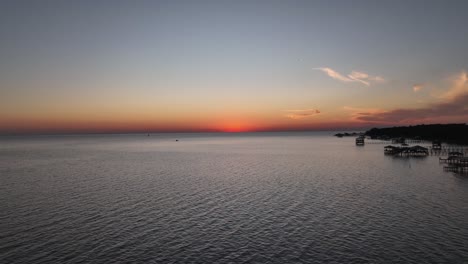 Pelicans-flying-towards-the-sunsetting-over-Mobile-bay