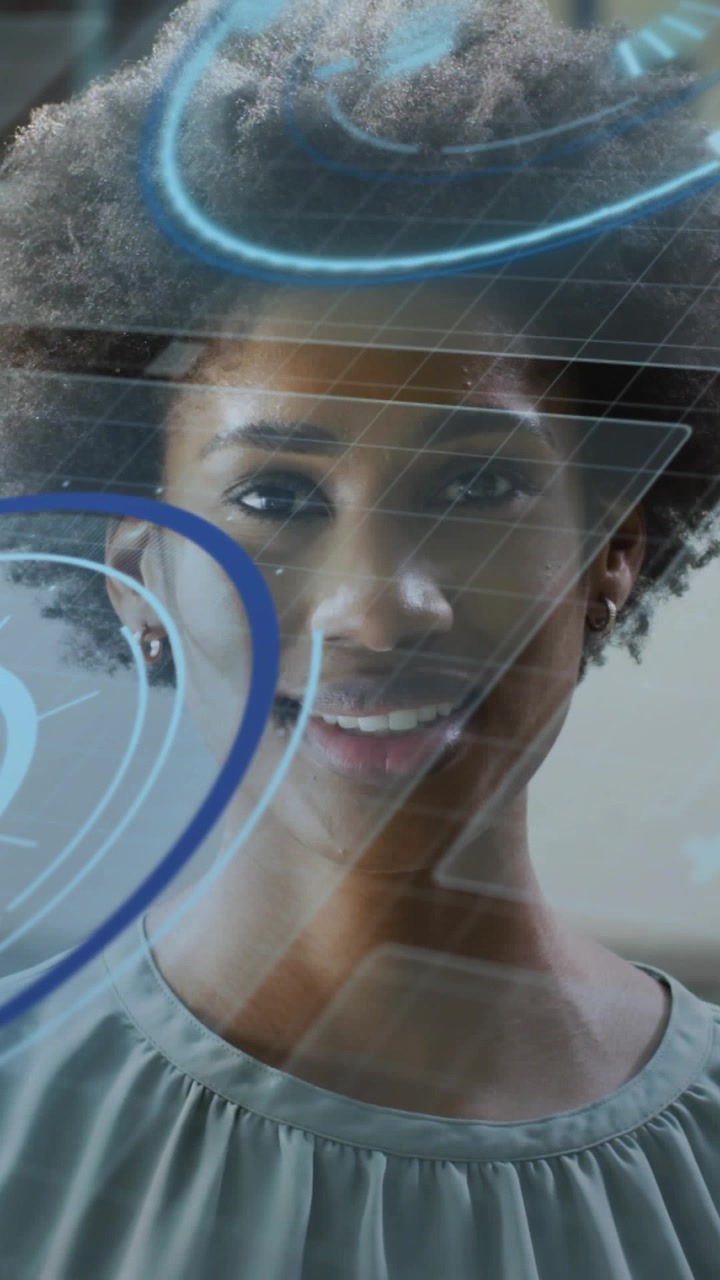 Vertical video: Woman lifting gaze to screen tilting as blue rings sliding revealing face using UI