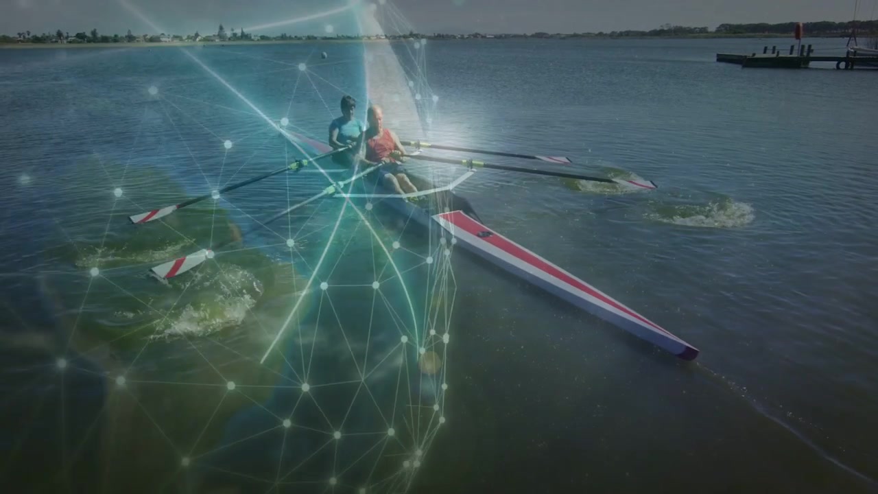 Two senior rowers starting synced strokes for fitness on lake, digital network appearing with wakes