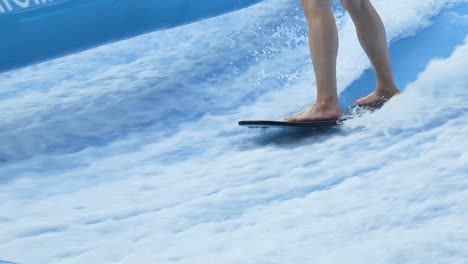 person surfing on an artificial wave