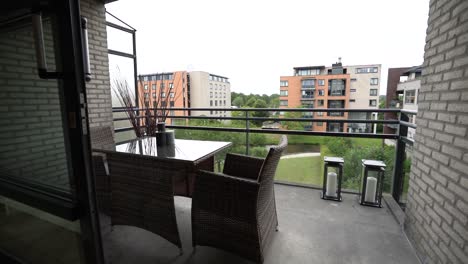 balcony of house with table and chairs