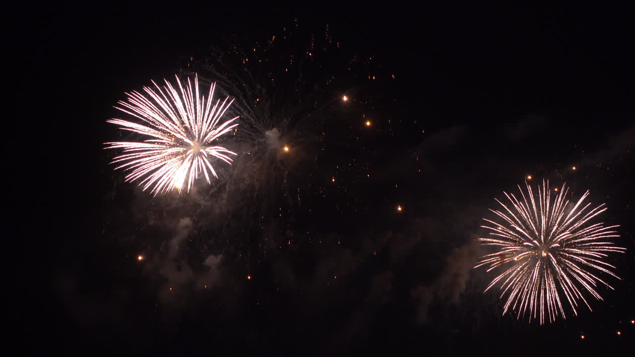 Firework display at night on sky background