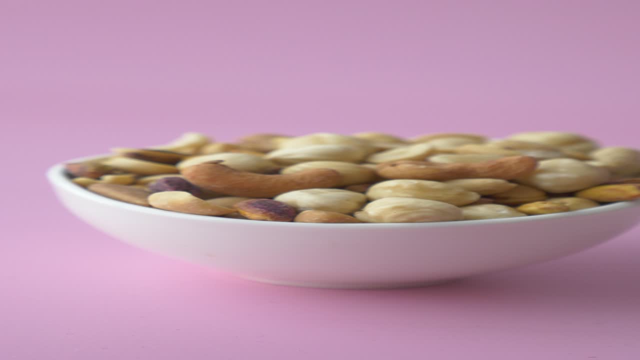 Mixed Nuts in a White Bowl