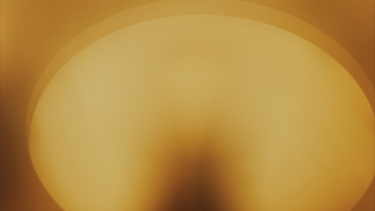Soft abstract golden circle of light with smooth gradient
