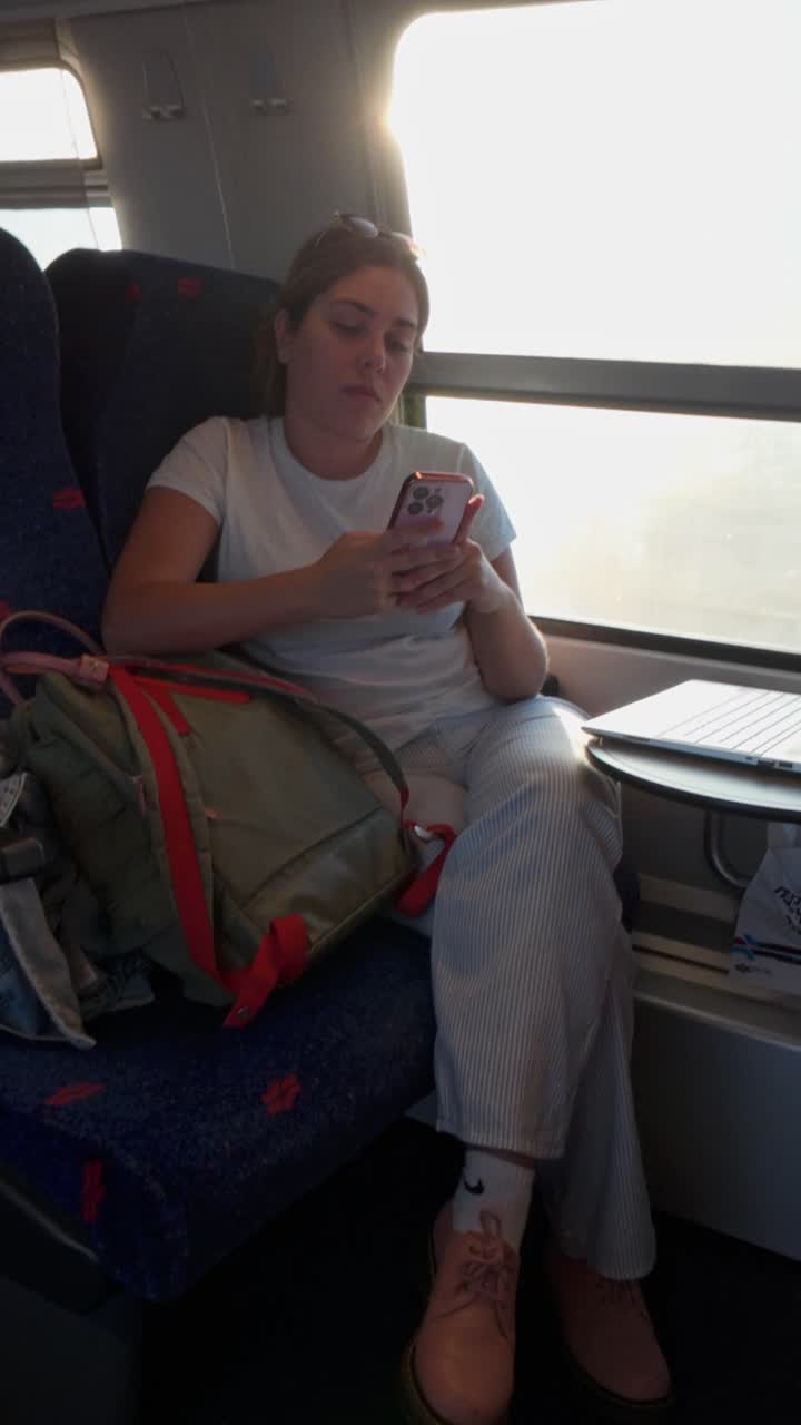 Candid Shot of a Girl Using Technology on a Journey