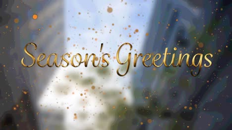 Animation-of-seasons-greetings-text-with-orange-spots-falling-over-cityscape-background