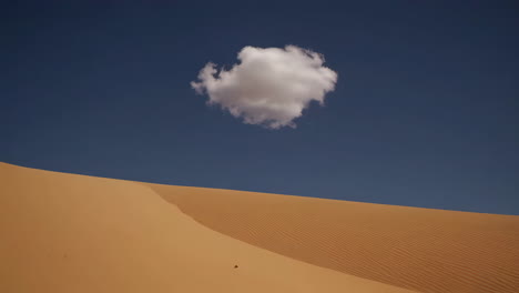 desert landscape with a solitary cloud