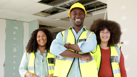 Portrait-of-smiling-casual-diverse-architects-working-in-office,-slow-motion-with-copy-space