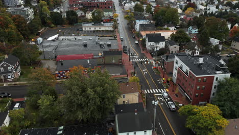 Birds-eye-flyover-of-Congress-Street-in-Autumn,-Portland-Maine