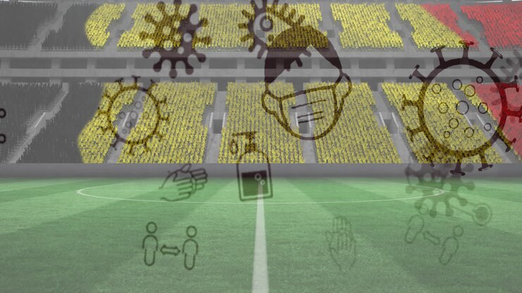 Animation of covid 19 icons over belgian flag in empty spots stadium