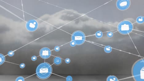 Animation-of-network-of-digital-icons-against-clouds-in-the-grey-sky