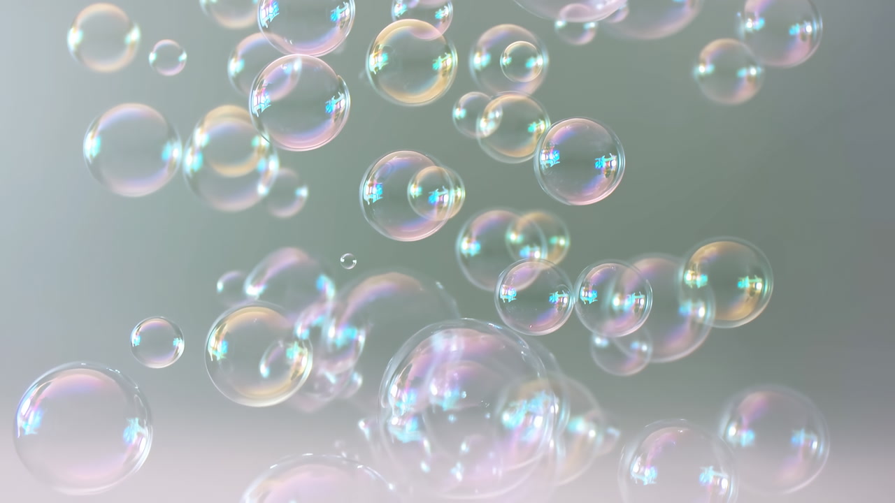 Iridescent Soap Bubbles Floating In Air, Soft Pastel Highlights And Translucent Surfaces Reflect Rainbow Sheen