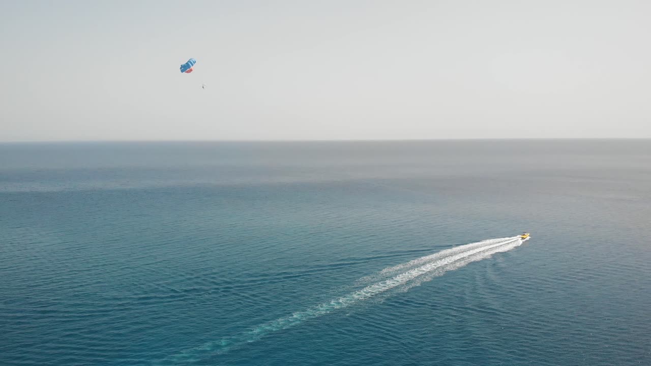 Aerial drone shot of a paraglider. Isolated sea on background. Protaras, Cyprus