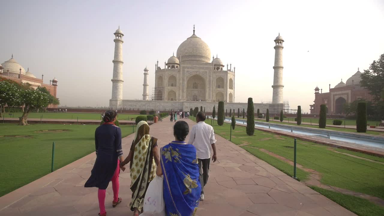People Walking Towards the Taj Mahal